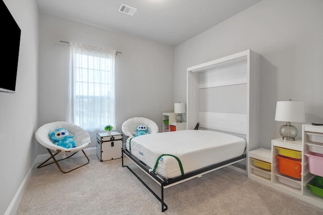 bedroom featuring light carpet, baseboards, and visible vents