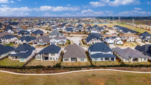 birds eye view of property with a residential view