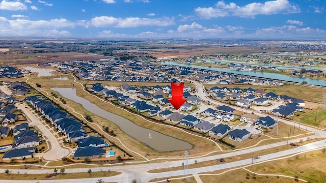 bird's eye view featuring a water view and a residential view