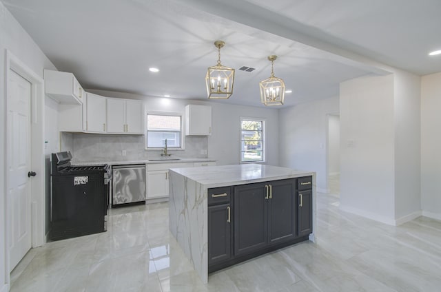 kitchen featuring a center island, white cabinetry, dishwasher, and decorative light fixtures