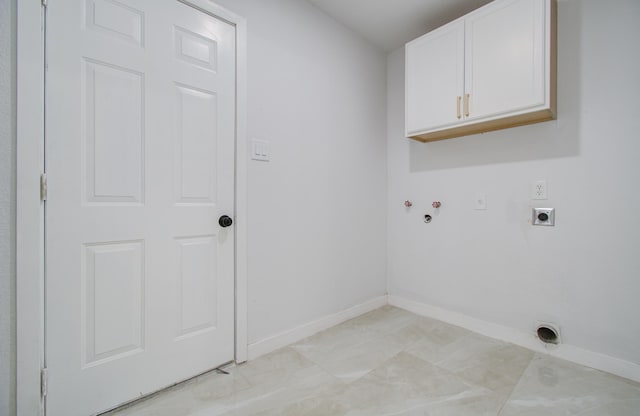 laundry room with baseboards, washer hookup, cabinet space, and hookup for an electric dryer