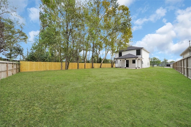 view of yard with a fenced backyard