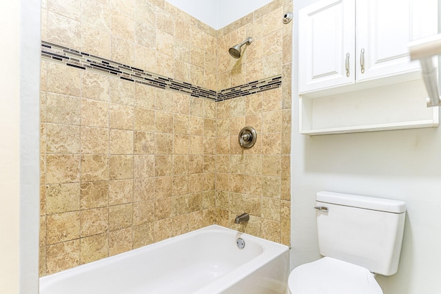 bathroom featuring shower / bathtub combination and toilet