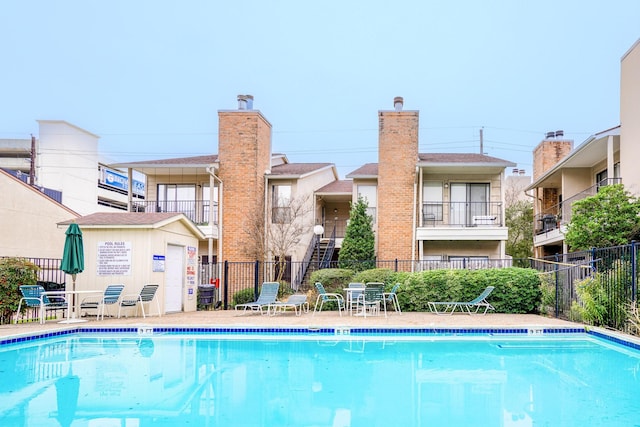 community pool featuring fence