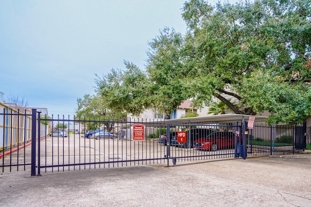 view of gate featuring fence