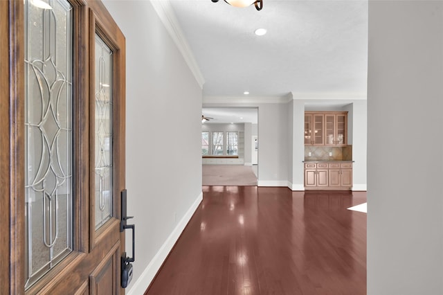 entrance foyer with baseboards, dark wood-type flooring, recessed lighting, and crown molding