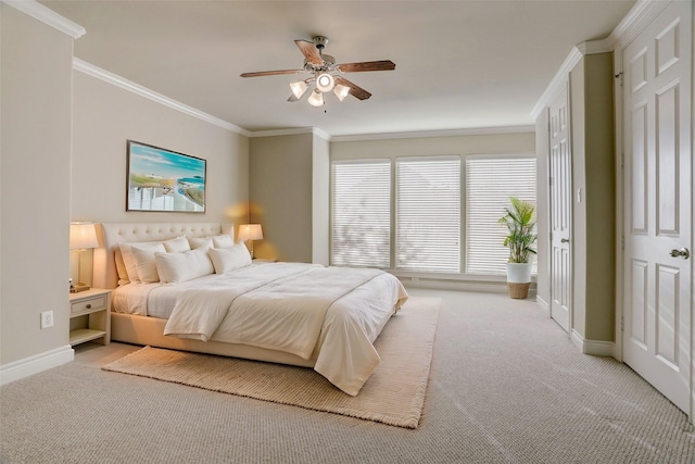 bedroom featuring ornamental molding, light carpet, baseboards, and a ceiling fan