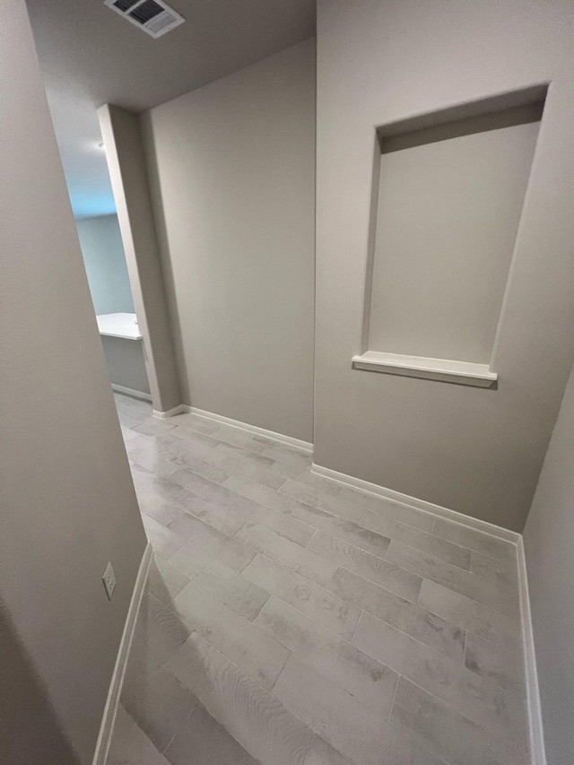 interior space featuring visible vents and baseboards