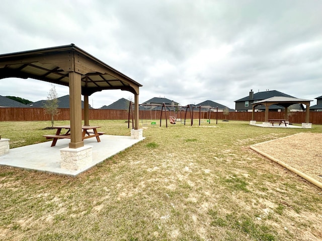 view of yard with a patio area, a fenced backyard, and a gazebo