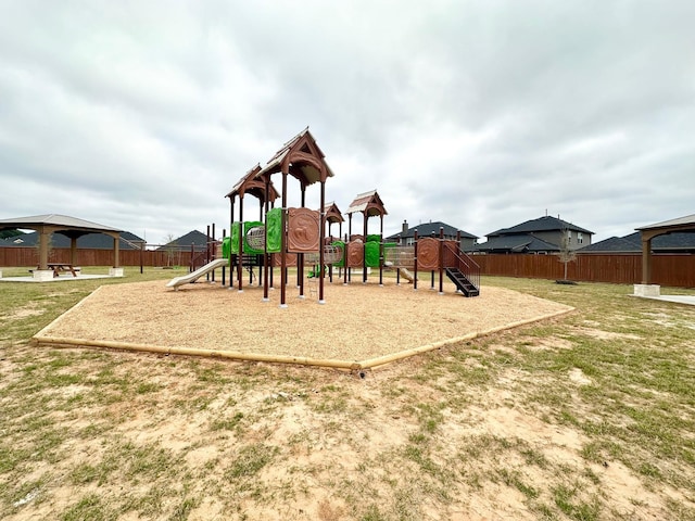 community playground featuring fence and a gazebo