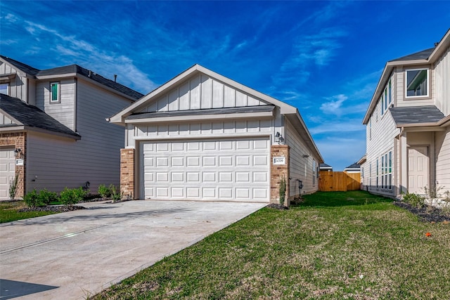 view of property exterior with concrete driveway, fence, a yard, board and batten siding, and brick siding