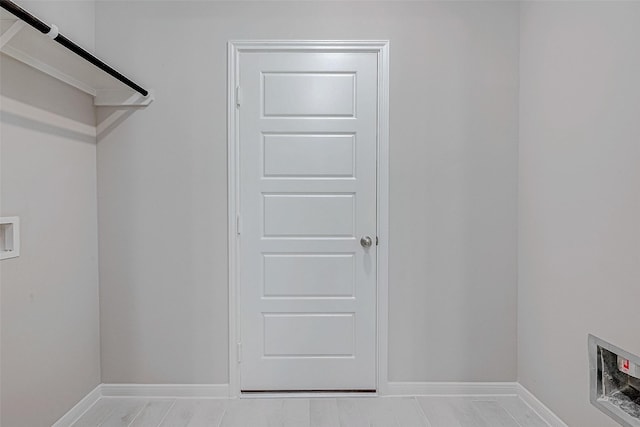 washroom with laundry area, baseboards, and washer hookup