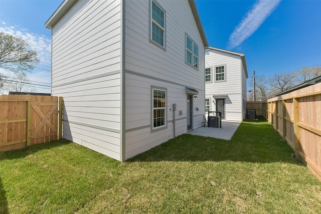 6835 New York St, Houston, TX 77021 - rear view of house featuring a patio area, a fenced backyard, central AC, and a yard