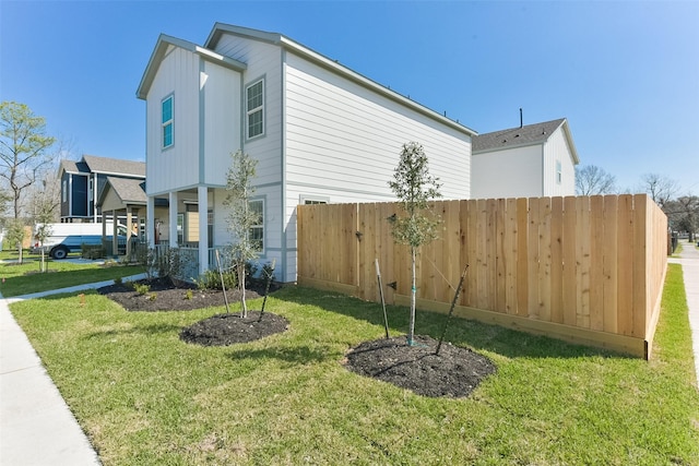 6835 New York St, Houston, TX 77021 - view of side of home with a yard, a porch, and fence