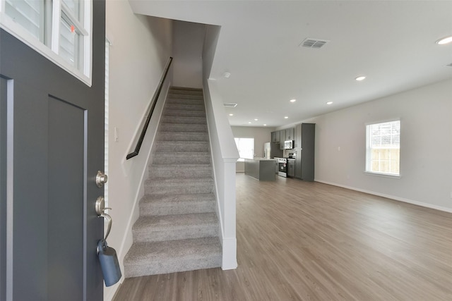 6835 New York St, Houston, TX 77021 - interior space featuring a wealth of natural light, light wood-style flooring, visible vents, and recessed lighting