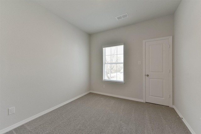 6835 New York St, Houston, TX 77021 - spare room featuring carpet floors, visible vents, and baseboards