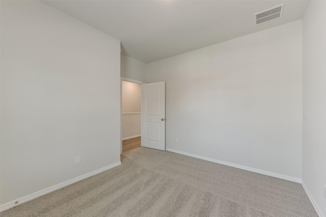 6835 New York St, Houston, TX 77021 - spare room featuring carpet, baseboards, and visible vents