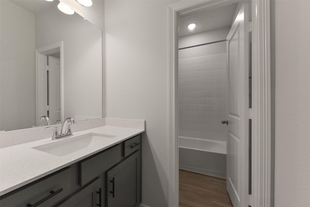 6835 New York St, Houston, TX 77021 - full bathroom featuring bathtub / shower combination, wood finished floors, and vanity