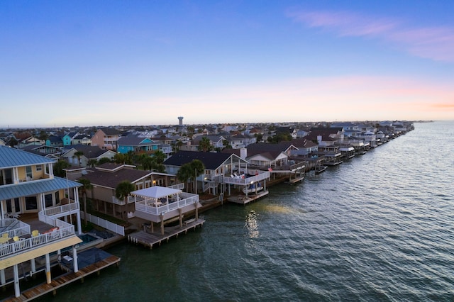 bird's eye view with a water view and a residential view