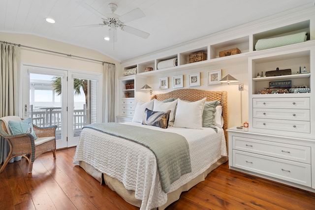 bedroom with a ceiling fan, access to outside, dark wood finished floors, and vaulted ceiling