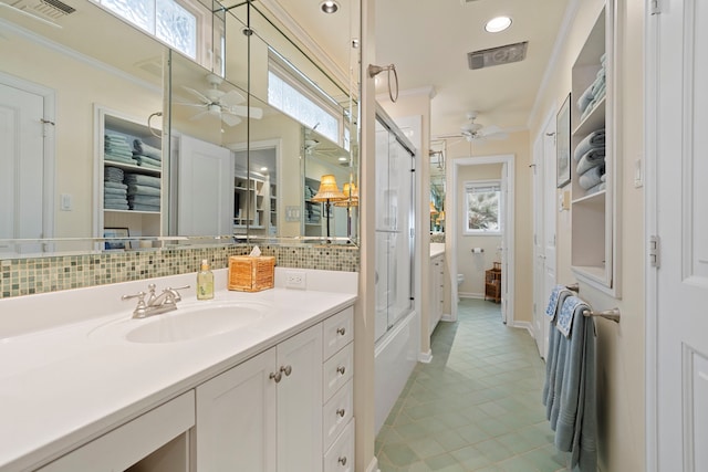 bathroom featuring toilet, a ceiling fan, visible vents, ornamental molding, and tasteful backsplash