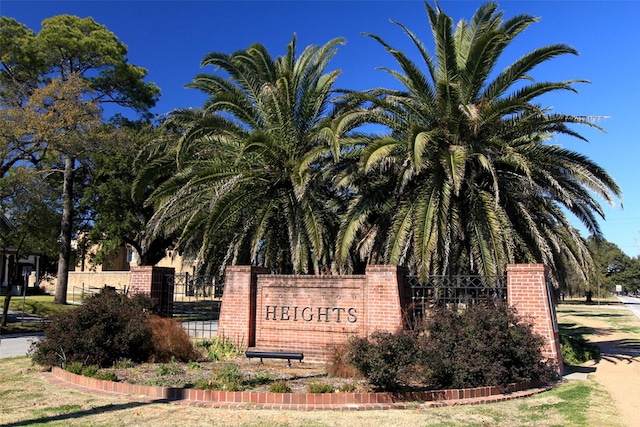 community sign featuring fence