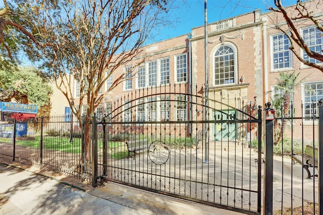 view of gate featuring a fenced front yard