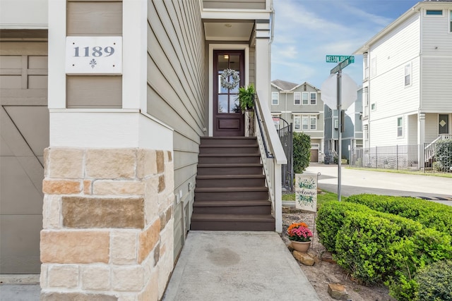 doorway to property with a residential view