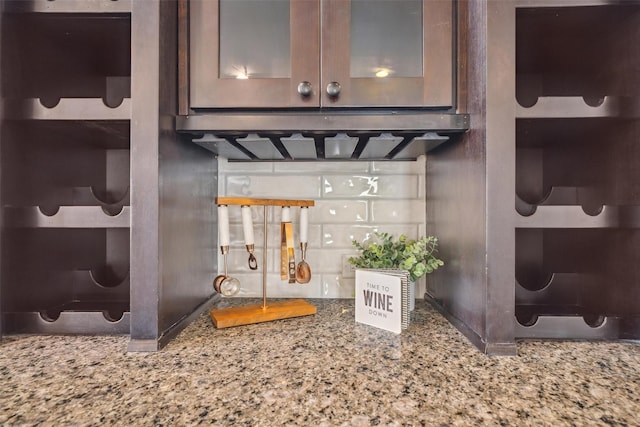 details with light stone counters and glass insert cabinets