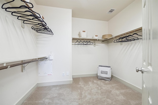 spacious closet with visible vents and carpet flooring