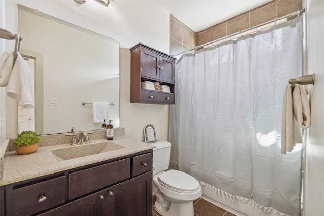 bathroom featuring tile patterned floors, toilet, and vanity