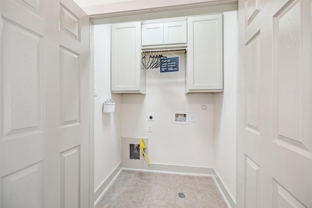 washroom featuring baseboards, hookup for a washing machine, hookup for a gas dryer, cabinet space, and electric dryer hookup