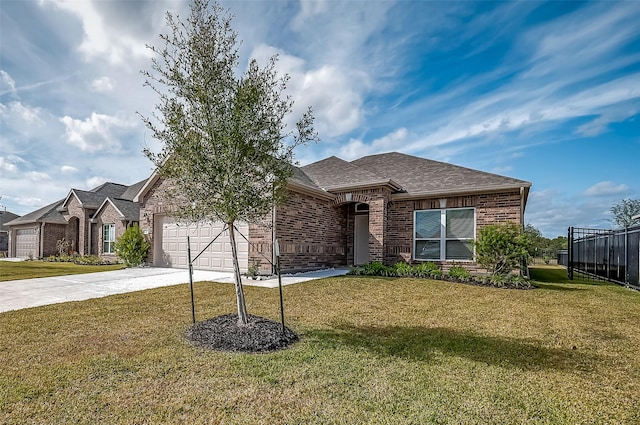 view of front facade featuring a garage, driveway, a front lawn, and brick siding