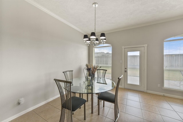 dining space with crown molding, a textured ceiling, an inviting chandelier, and light tile patterned floors