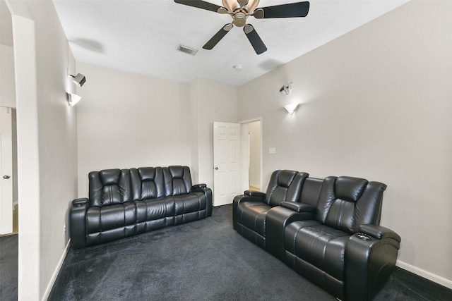 cinema featuring baseboards, visible vents, dark carpet, and a ceiling fan