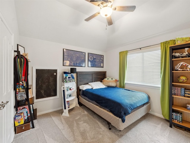 bedroom featuring vaulted ceiling, carpet, a ceiling fan, and baseboards