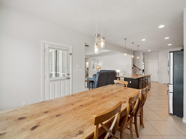 dining area with recessed lighting and light tile patterned flooring