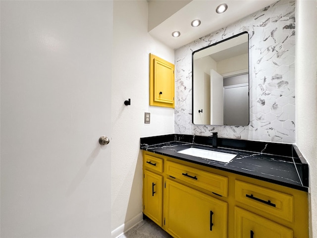 bathroom with vanity and baseboards