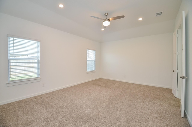 unfurnished room featuring recessed lighting, visible vents, a ceiling fan, light carpet, and baseboards