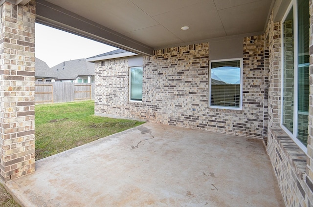 view of patio / terrace featuring fence