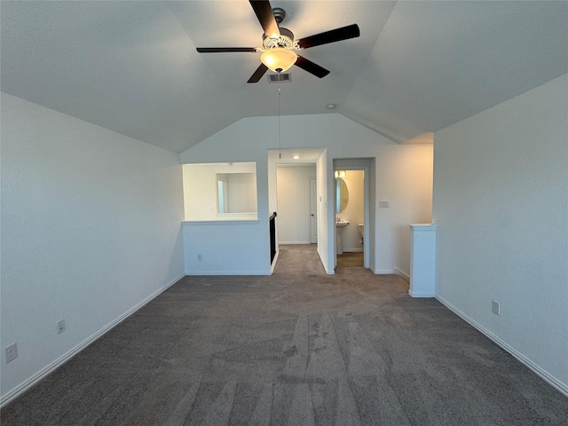 additional living space featuring lofted ceiling, carpet, baseboards, and visible vents