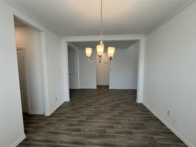 unfurnished dining area with baseboards, ornamental molding, wood tiled floor, and an inviting chandelier