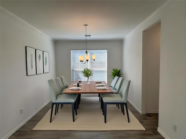 dining area with an inviting chandelier, baseboards, ornamental molding, and dark wood-type flooring