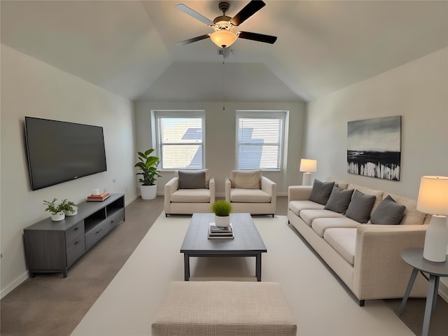 living room with lofted ceiling, baseboards, a ceiling fan, and light colored carpet