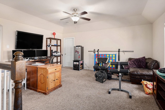 office space featuring light carpet, visible vents, lofted ceiling, and a ceiling fan