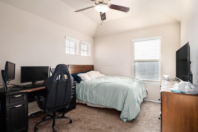 bedroom featuring ceiling fan, vaulted ceiling, and carpet flooring