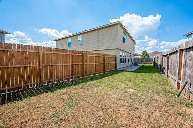 view of yard with a fenced backyard