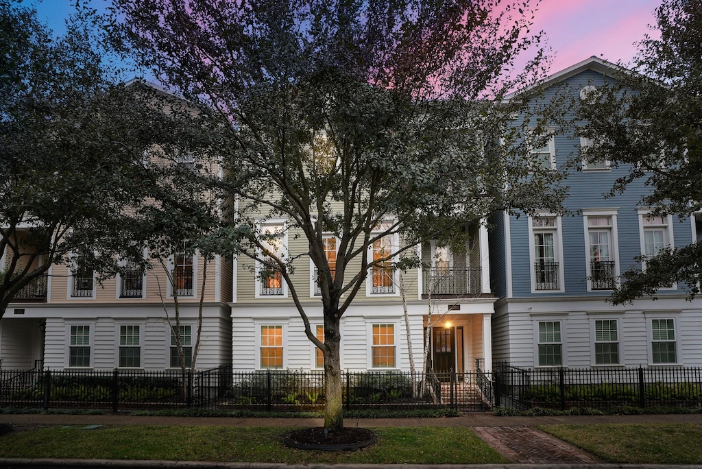 view of building exterior featuring a fenced front yard