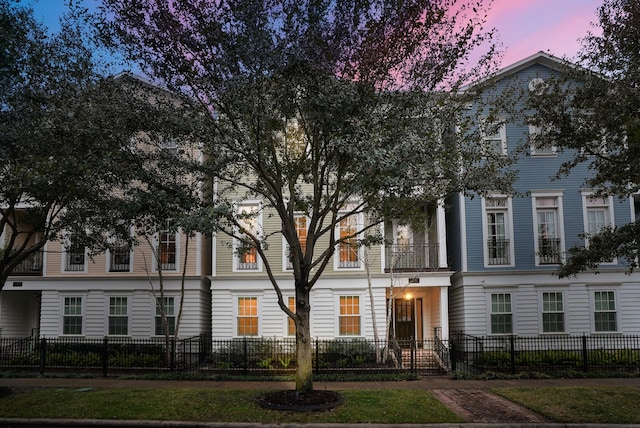 view of building exterior featuring a fenced front yard