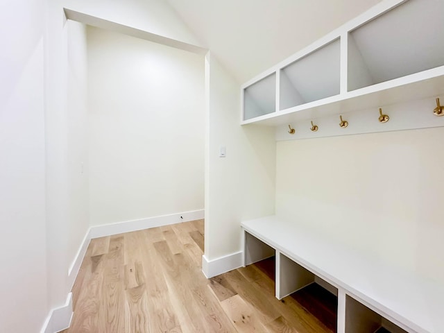 mudroom featuring baseboards and wood finished floors